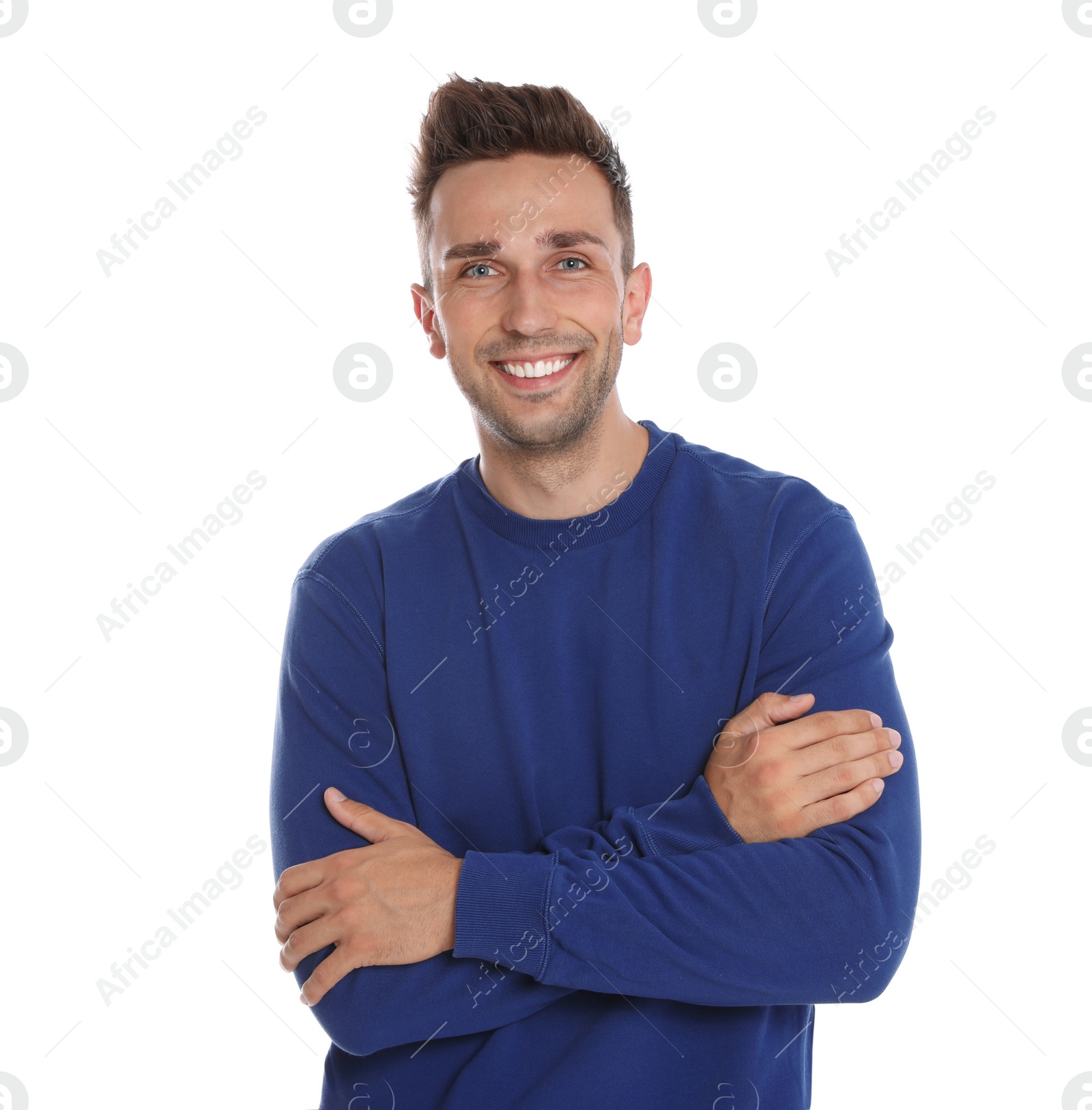 Photo of Happy young man in blue sweatshirt on white background. Winter season