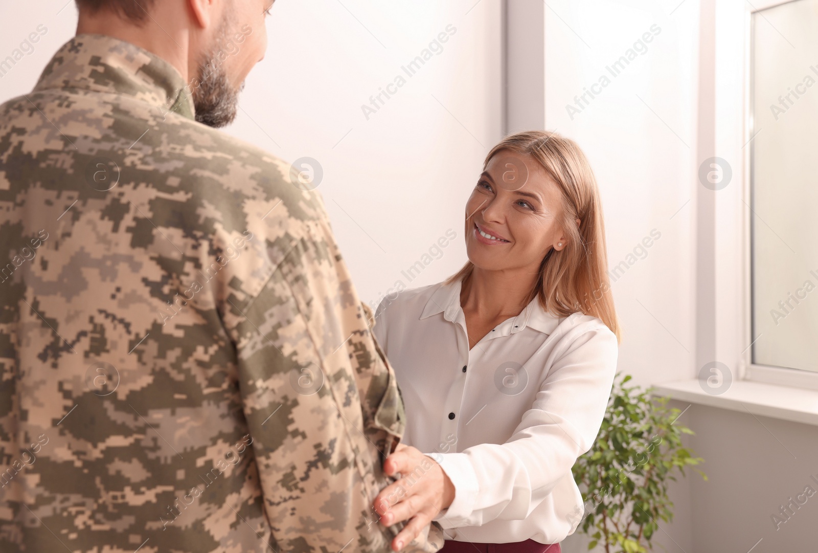 Photo of Psychologist working with military officer in office