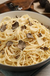 Photo of Tasty spaghetti with truffle on table, closeup