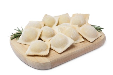 Uncooked ravioli and rosemary on white background