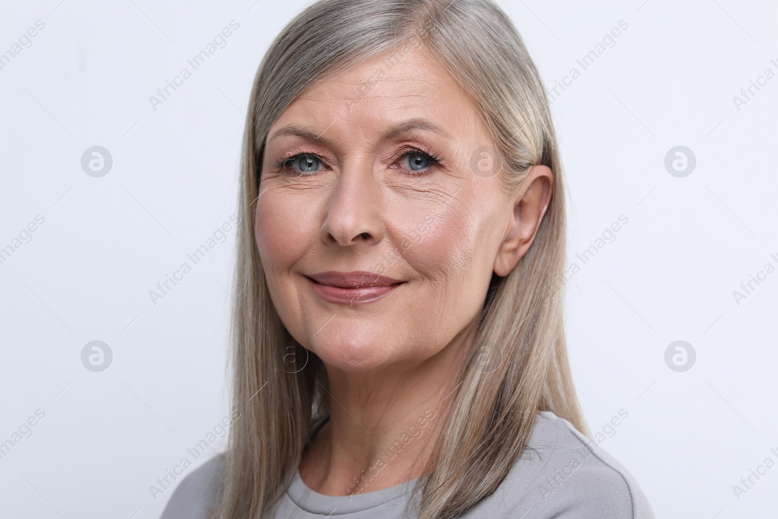 Photo of Portrait of beautiful senior woman on white background