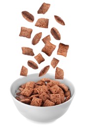 Sweet crispy corn pads falling into bowl with milk on white background 