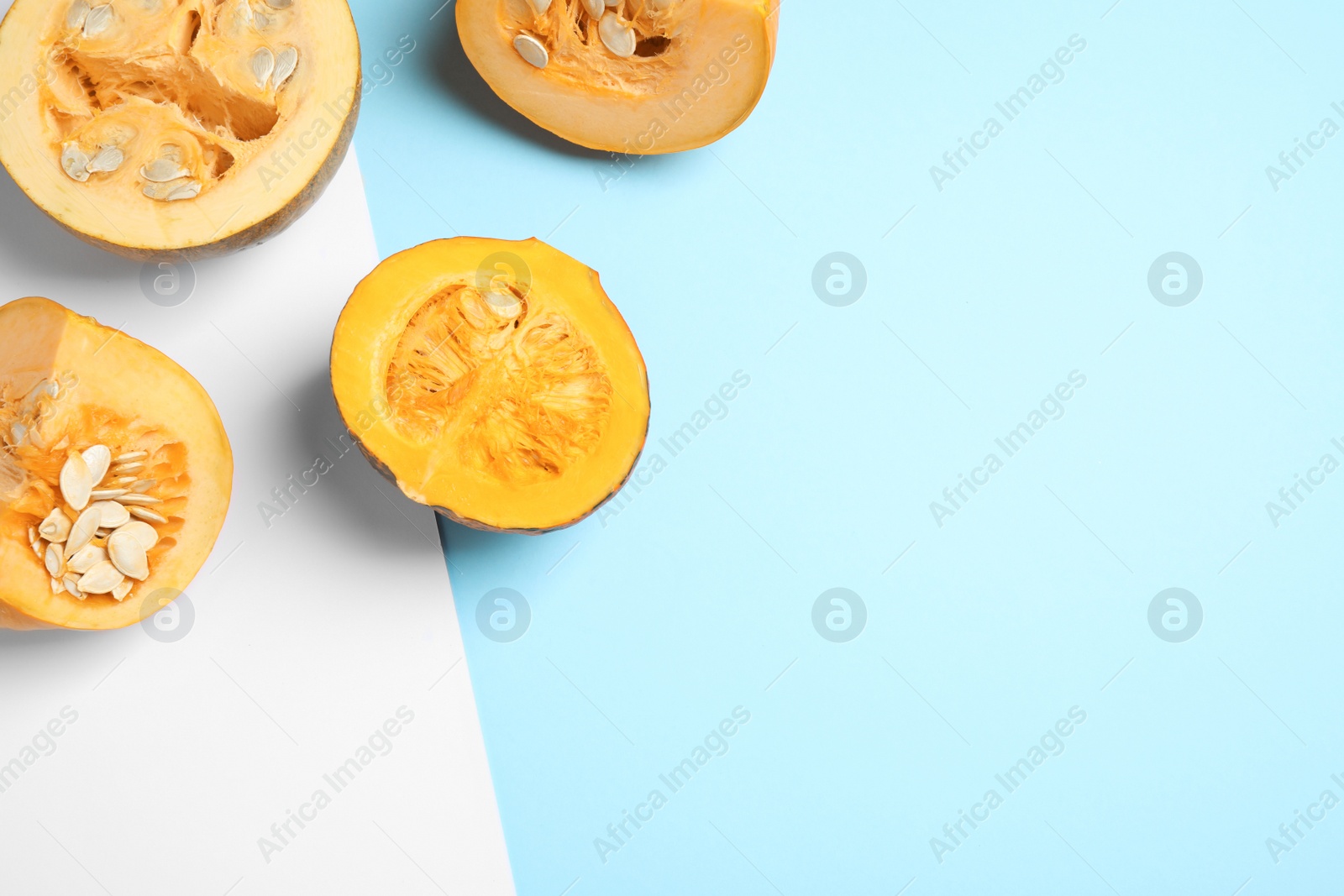 Photo of Fresh ripe pumpkins on color background, flat lay with space for text. Holiday decoration