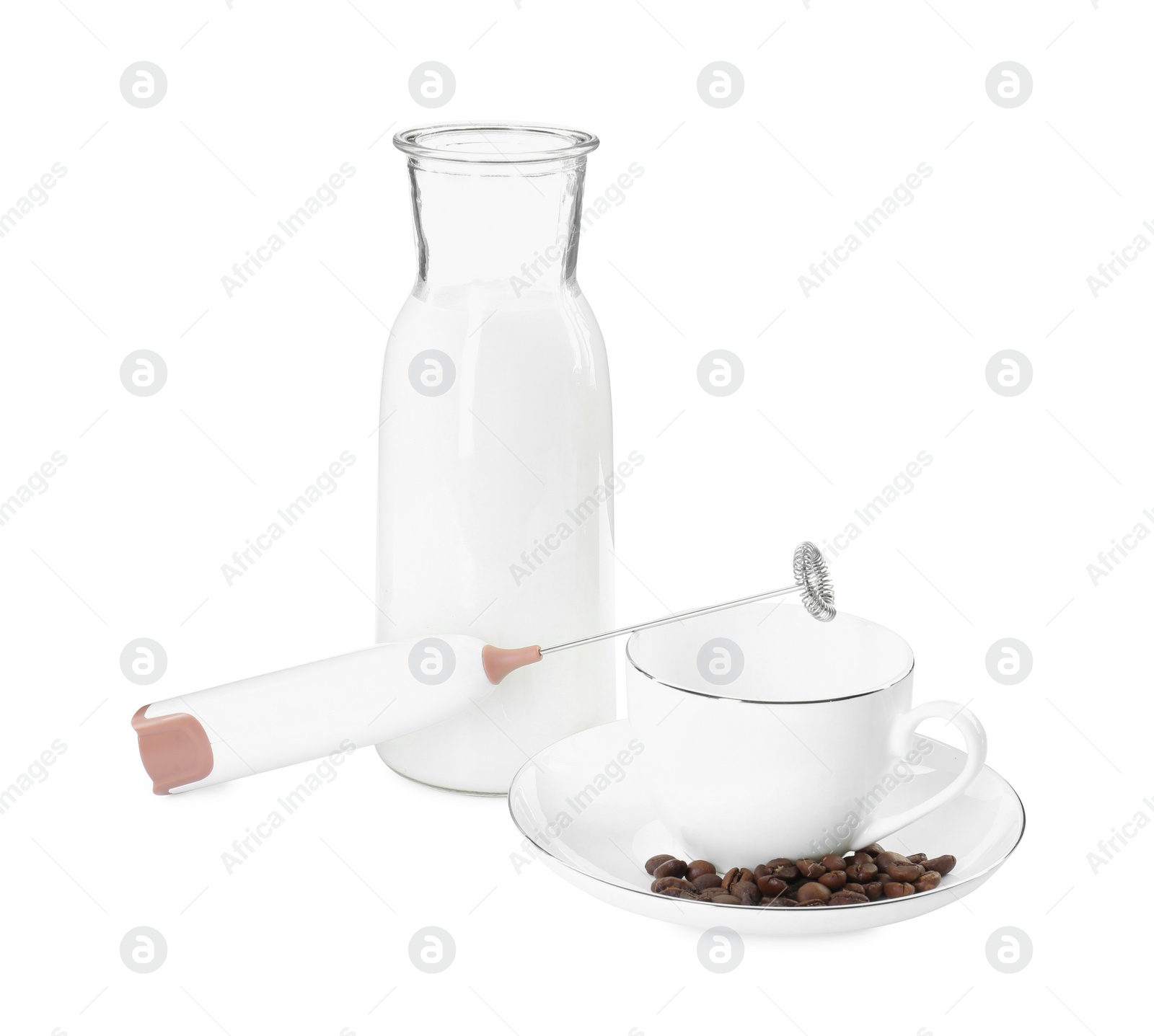 Photo of Mini mixer (milk frother), cup, coffee beans and bottle isolated on white