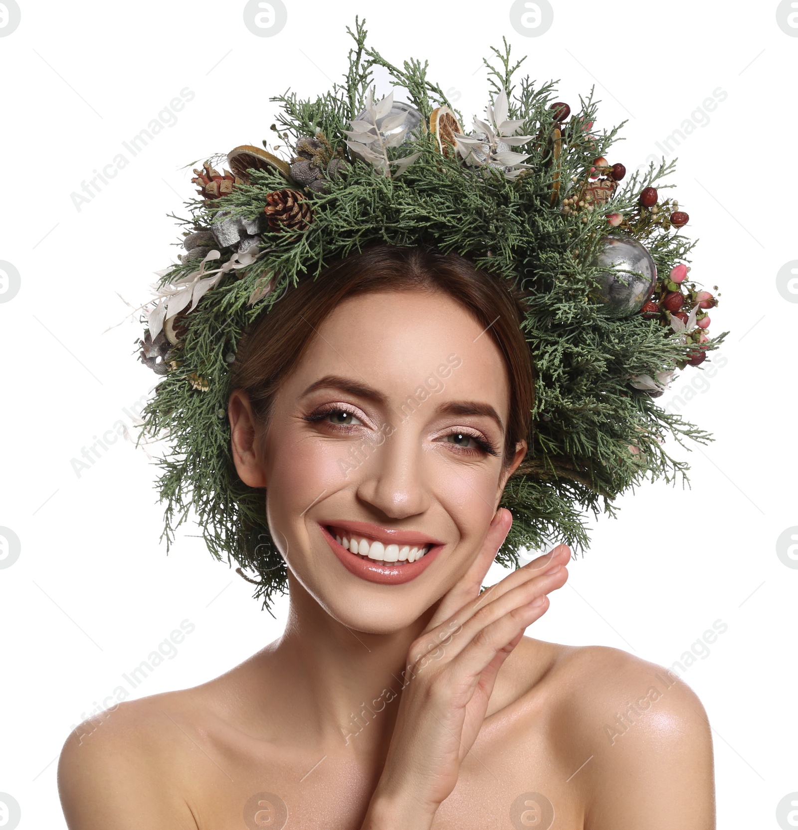 Photo of Beautiful young woman wearing Christmas wreath on white background