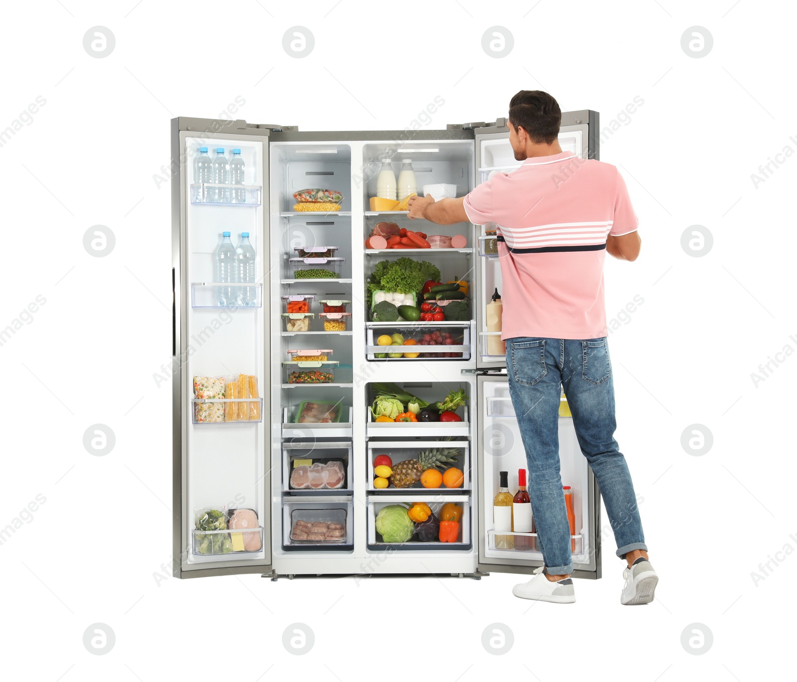 Photo of Man taking cheese from refrigerator on white background