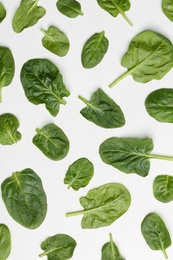 Fresh leaves of spinach isolated on white, top view