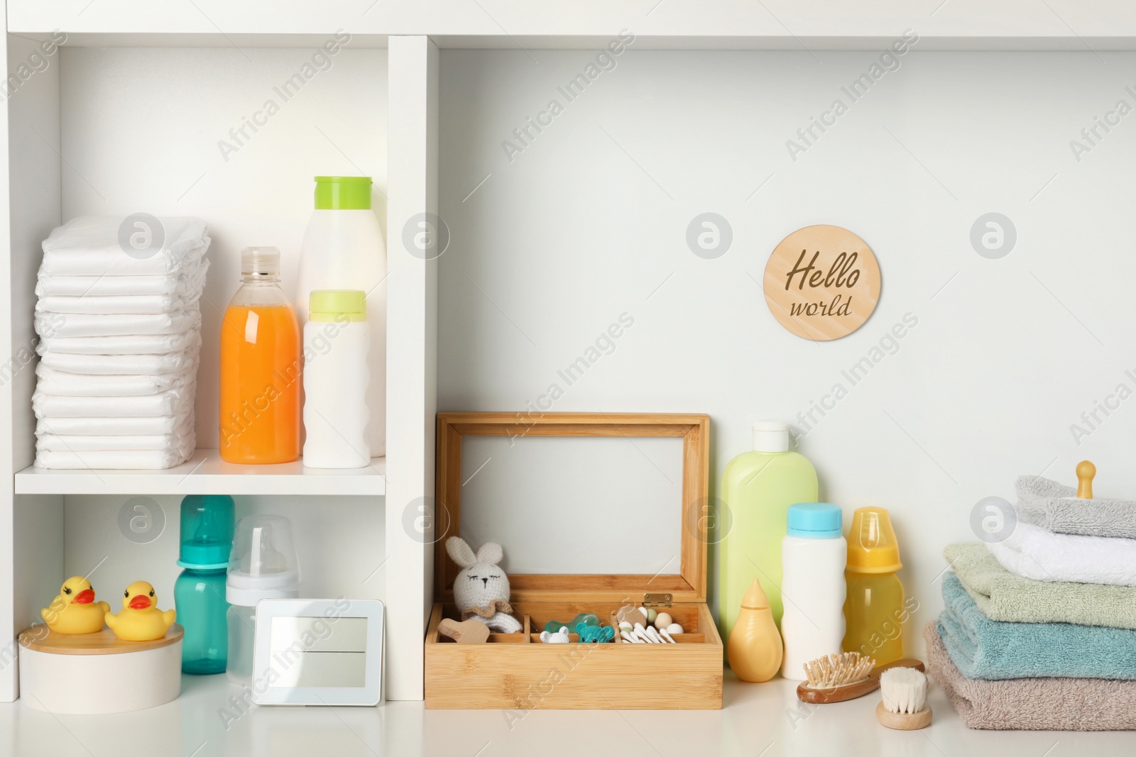 Photo of Toys and baby accessories on white rack