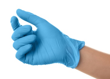 Person in blue latex gloves holding something against white background, closeup on hand
