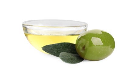 Cooking oil in glass bowl, olive and leaves on white background