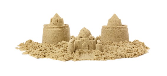 Photo of Pile of sand with beautiful castles isolated on white