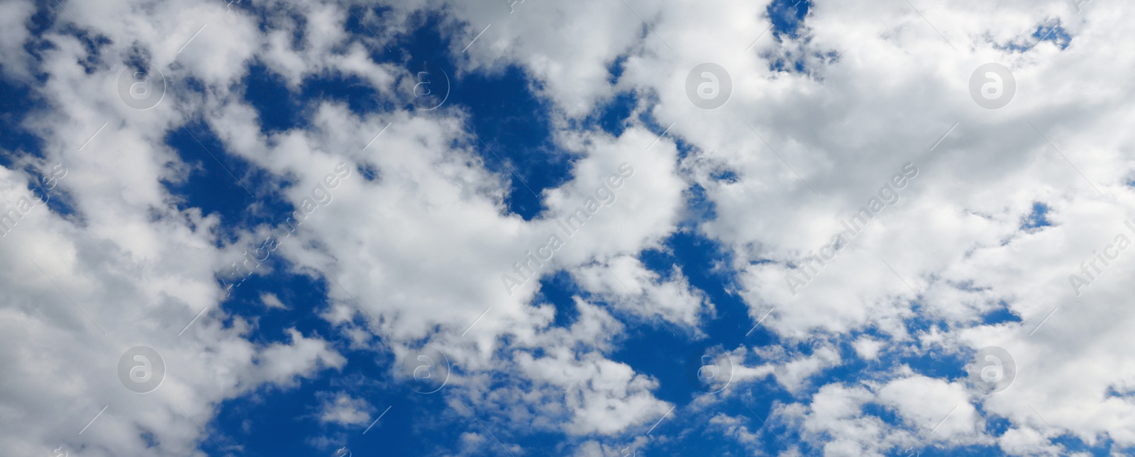 Image of Picturesque view of beautiful blue sky with white clouds on sunny day, banner design