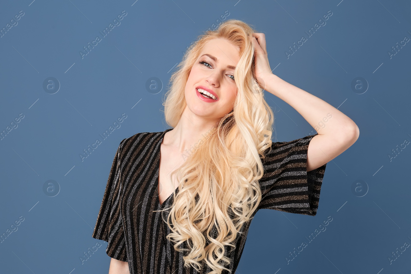 Photo of Portrait of young model with beautiful  hair on color background