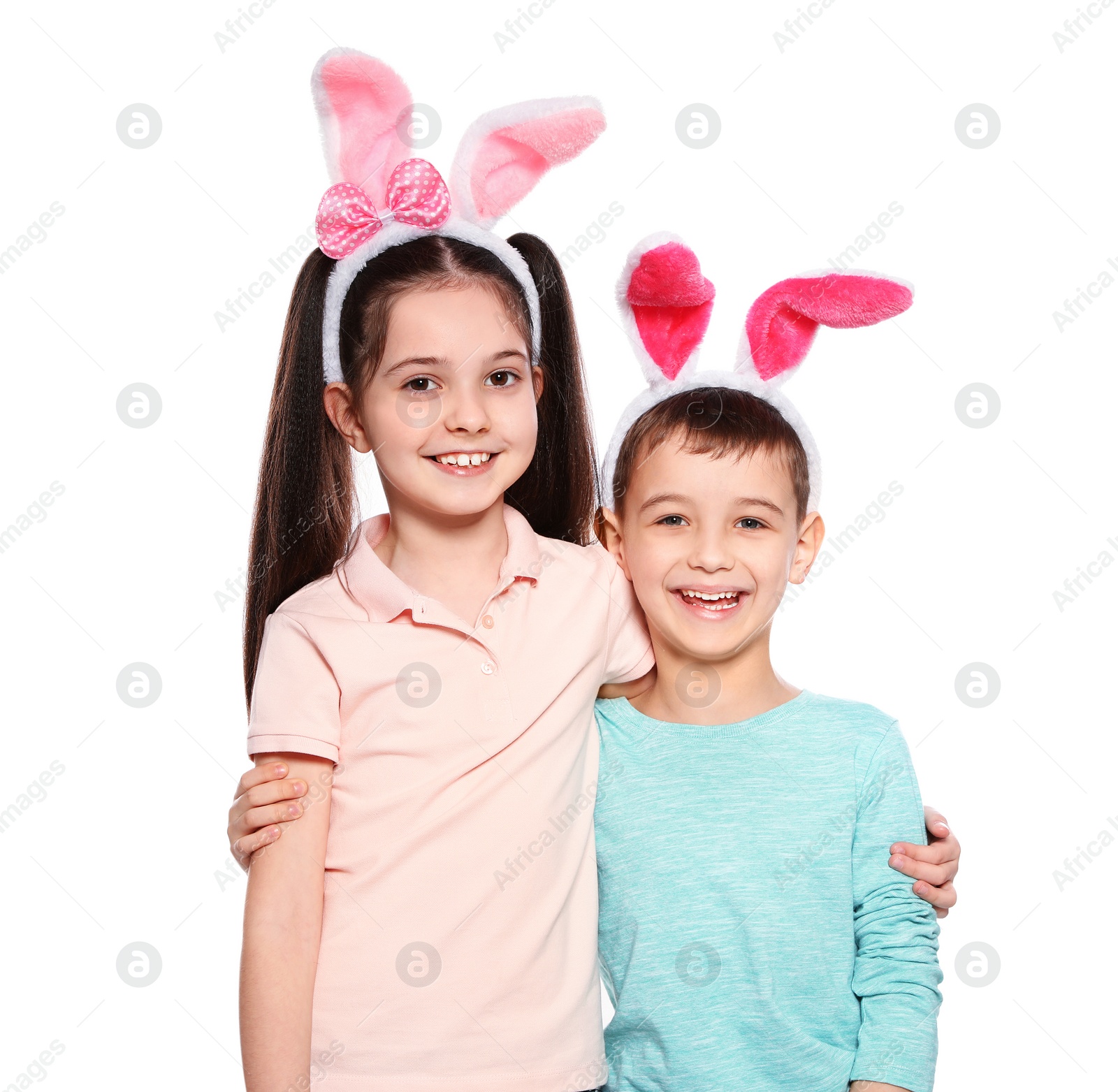 Photo of Cute children in Easter bunny ears headbands on white background