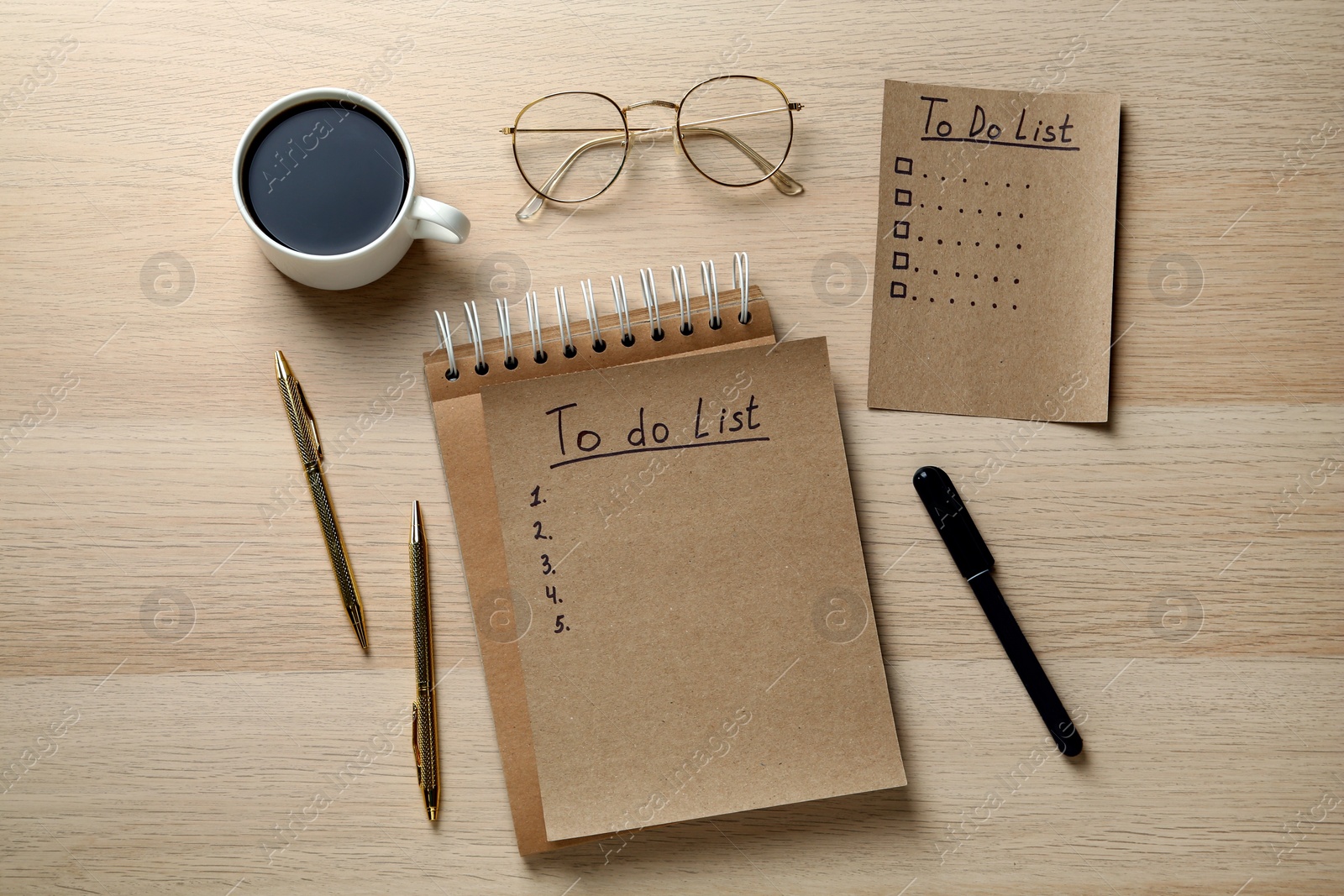 Photo of Flat lay composition with unfilled To Do lists and cup of coffee on wooden table