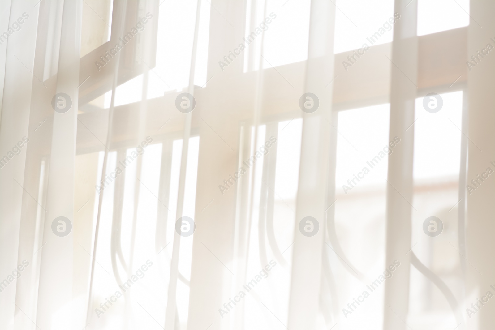 Photo of Window behind white curtain indoors in morning