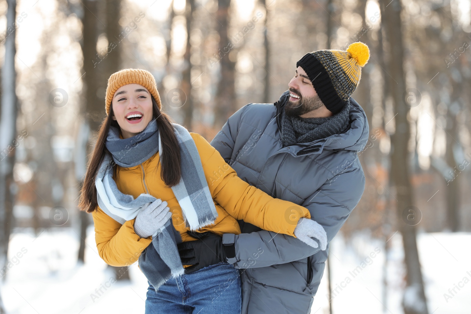 Photo of Happy young couple having fun outdoors on winter day