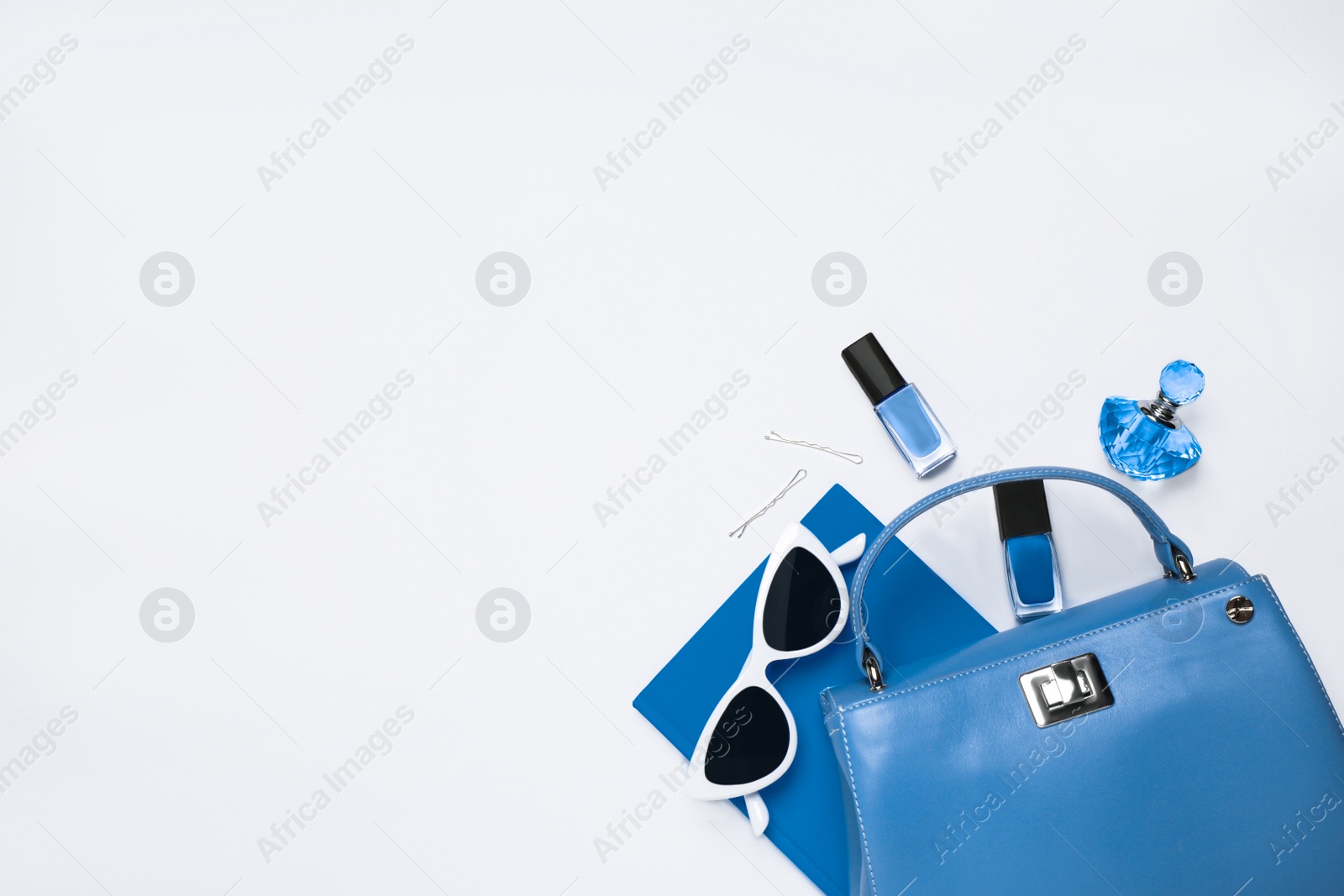 Photo of Flat lay composition inspired by color of the year 2020  (Classic blue) on white background