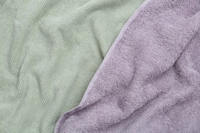 Photo of Crumpled soft towels as background, top view