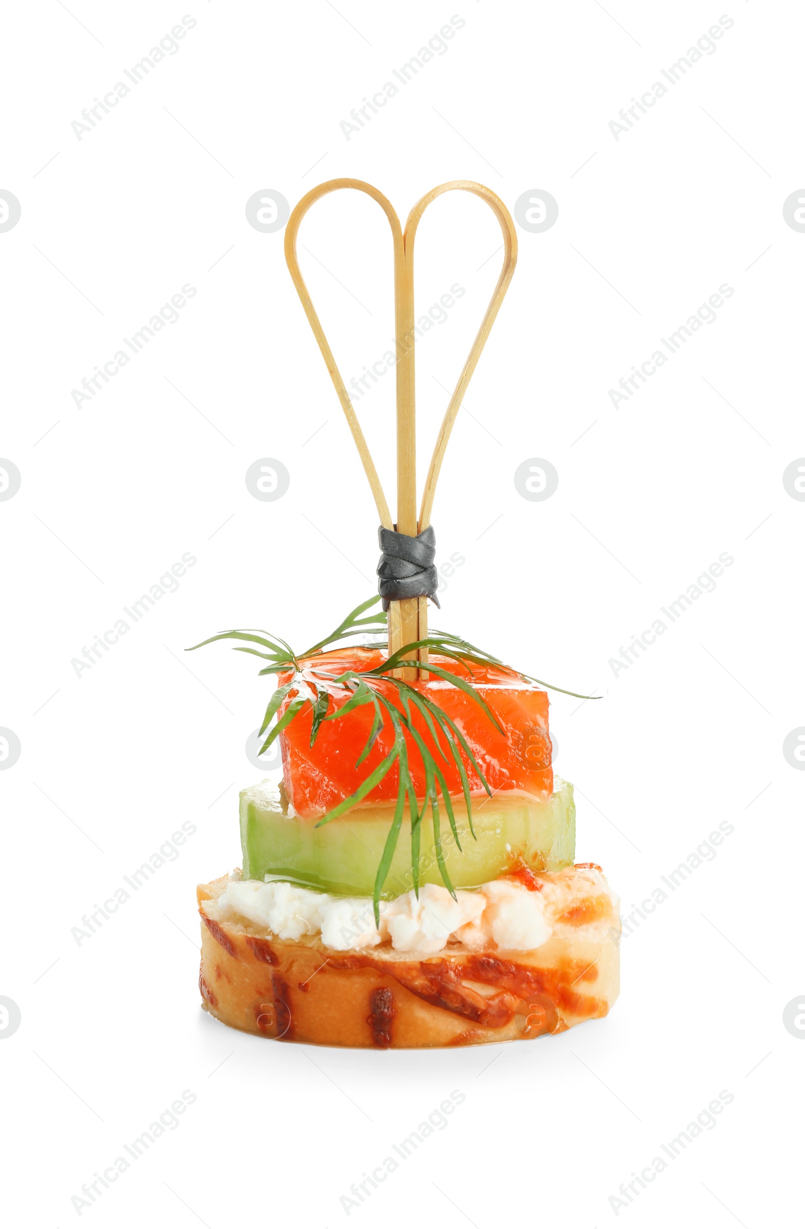 Photo of Tasty canape with salmon, cucumber, bread and cream cheese isolated on white