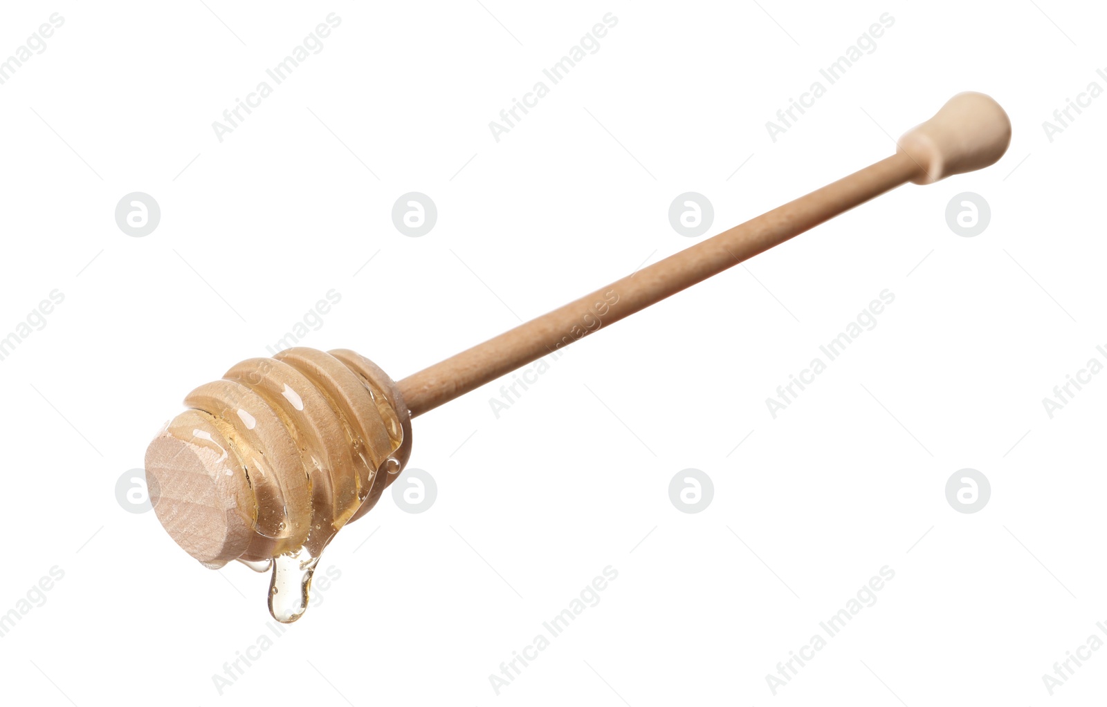 Photo of Natural honey dripping from dipper on white background