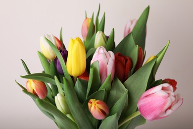 Photo of Bouquet of colorful tulips on white background, closeup