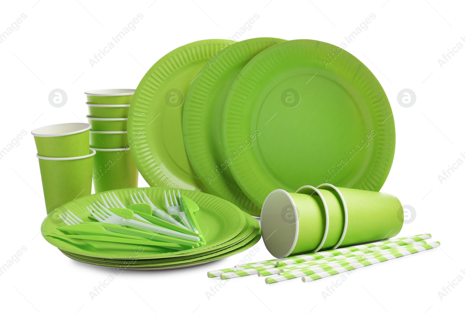 Photo of Set of bright disposable tableware on white background