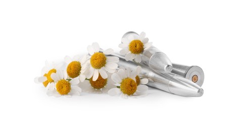 Metal bullets and beautiful flowers isolated on white