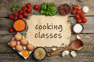 Parchment with inscription Cooking Classes and different ingredients on wooden table, flat lay