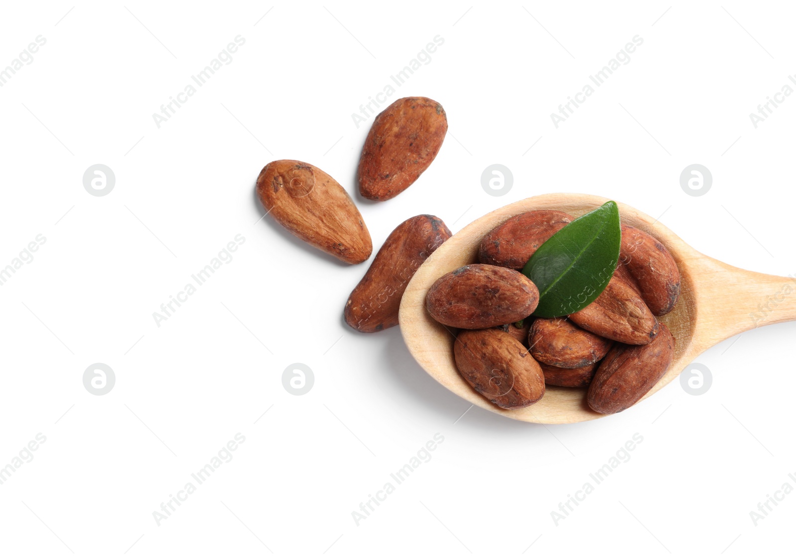 Photo of Wooden spoon with cocoa beans and leaf isolated on white, top view