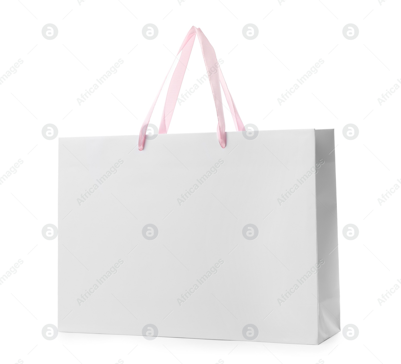 Photo of Paper shopping bag with handles on white background. Mockup for design