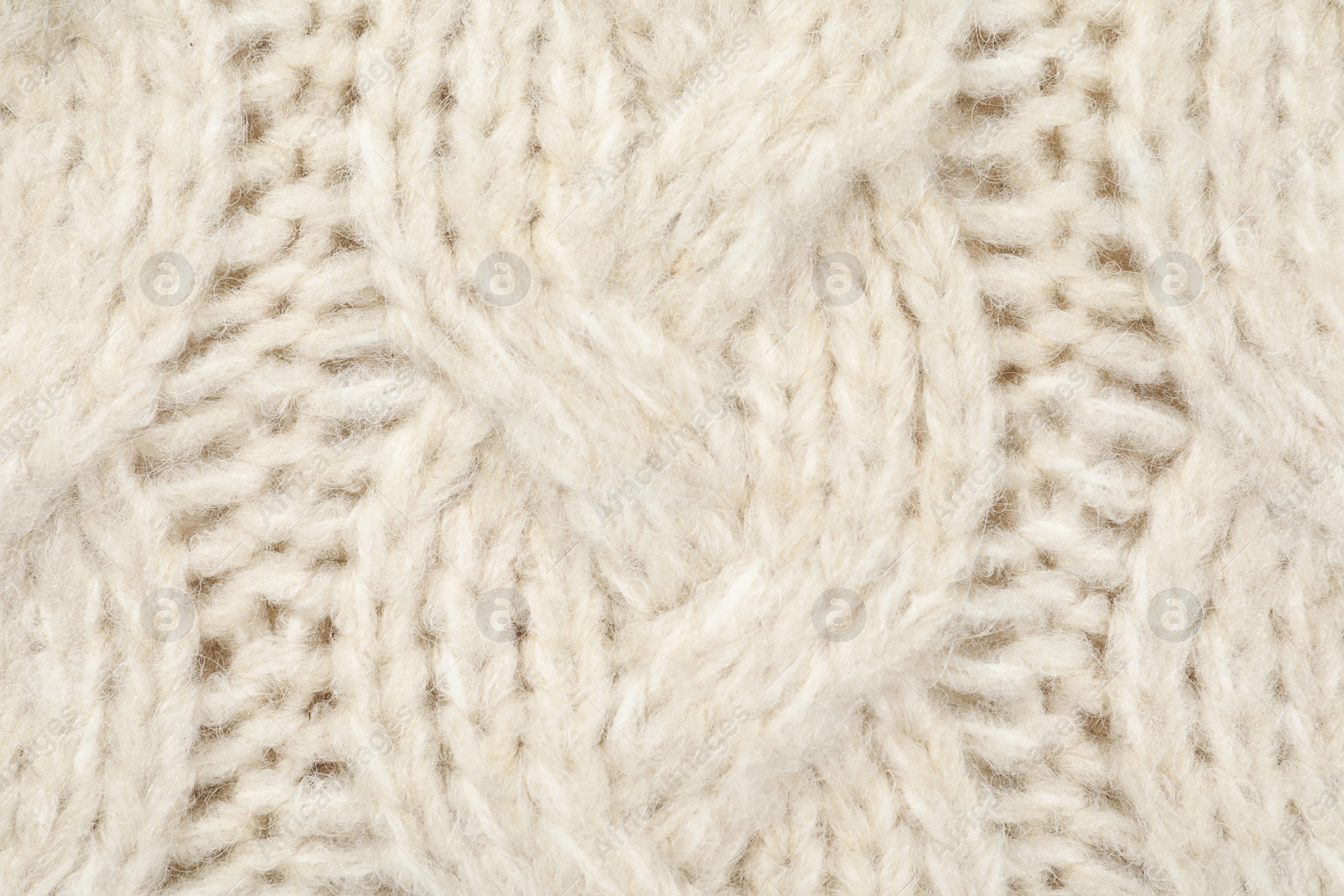 Photo of Texture of cozy warm sweater as background, closeup