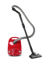 Modern red vacuum cleaner isolated on white