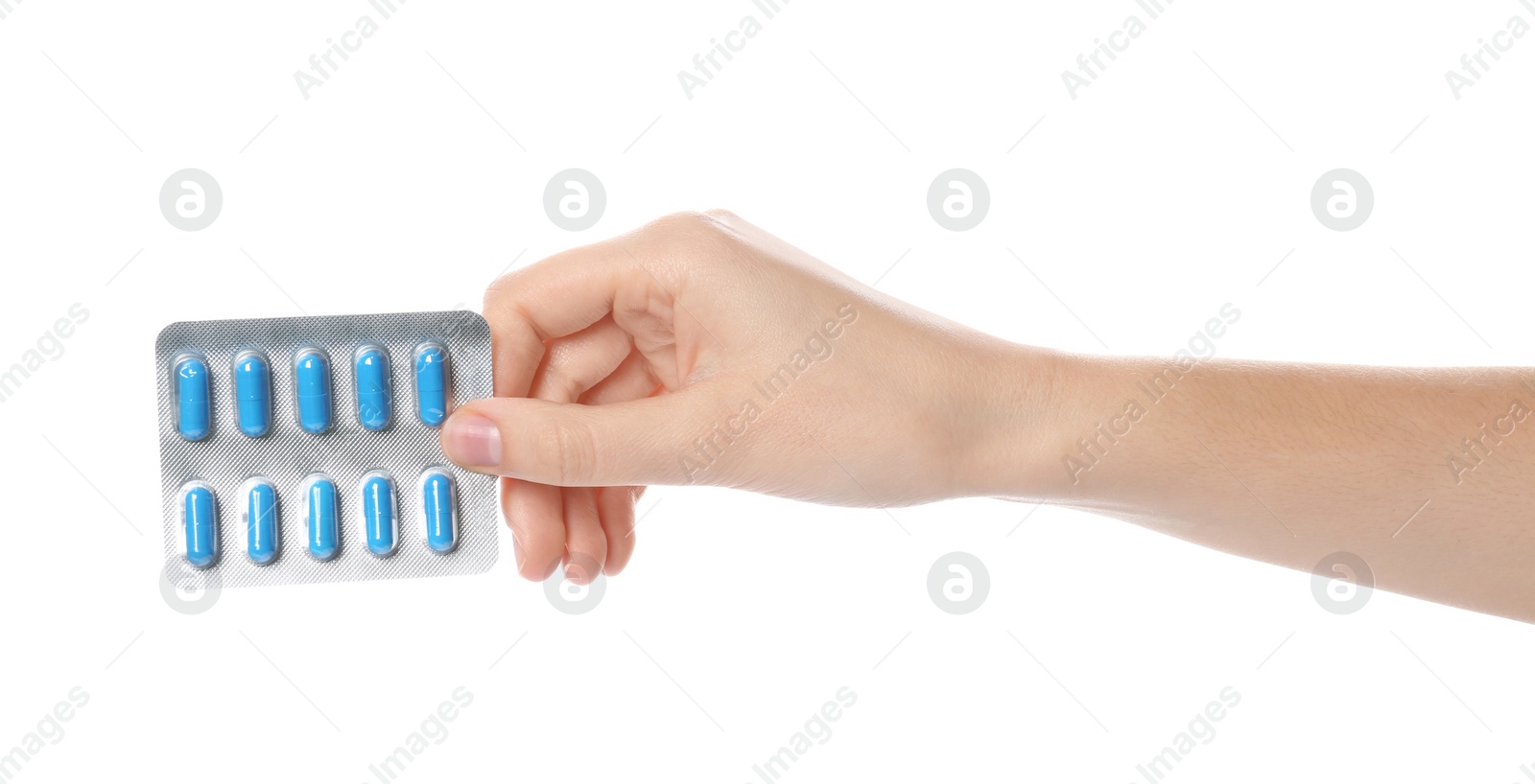 Photo of Woman holding pills in blister pack on white background, closeup