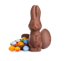 Photo of Chocolate Easter bunny and eggs on white background