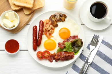 Delicious breakfast with sunny side up eggs served on white wooden table, flat lay