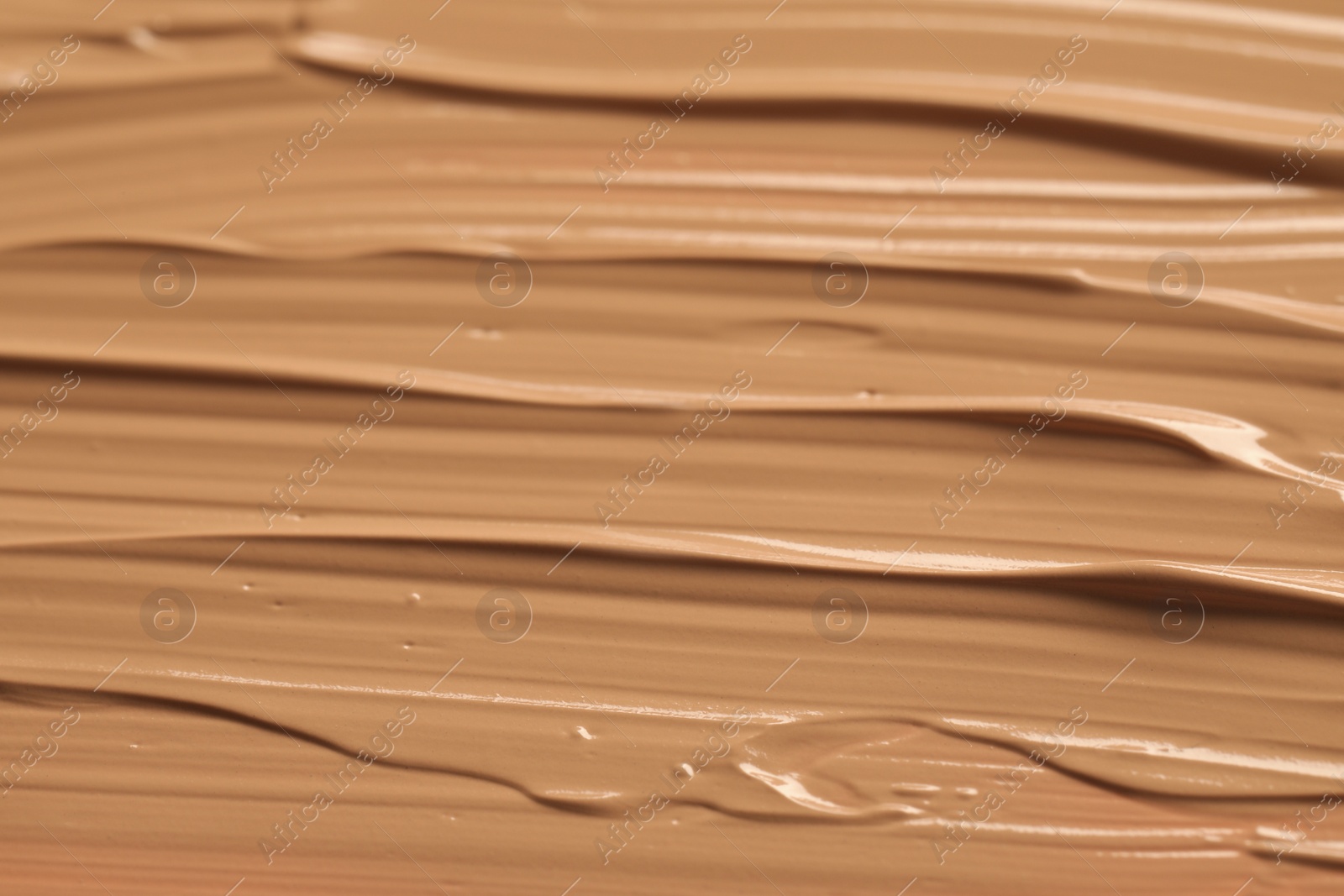 Photo of Texture of liquid skin foundation as background, closeup