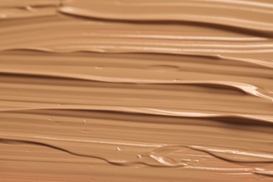 Photo of Texture of liquid skin foundation as background, closeup