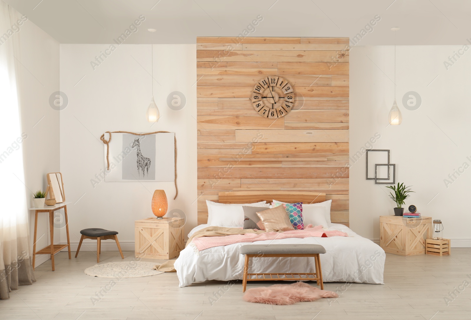 Photo of Stylish room interior with comfortable bed near wooden wall