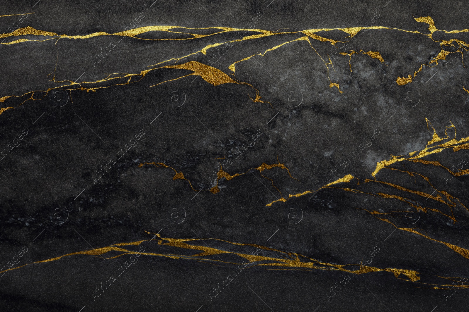 Image of Beautiful black and gold marble surface as background