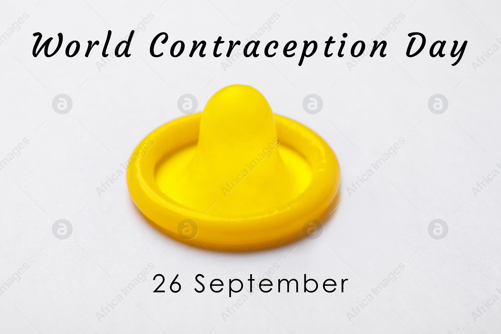 Image of World contraception day. Yellow condom on white background, closeup