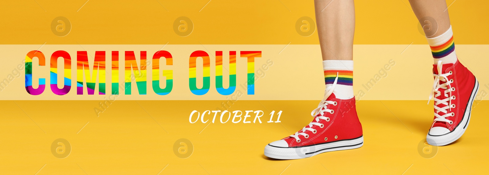 Image of National Coming Out day, October 11. Woman in gumshoes and socks with pride rainbow on yellow background, closeup. Banner design