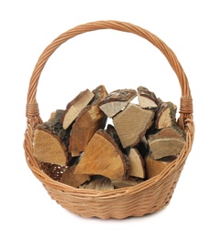 Wicker basket with firewood on white background