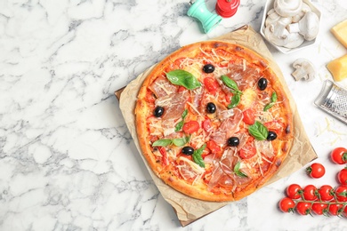 Flat lay composition with delicious pizza and ingredients on table