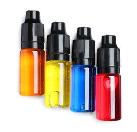 Bottles with different food coloring on white background, top view