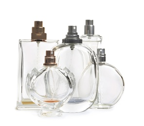 Different perfume bottles on white background