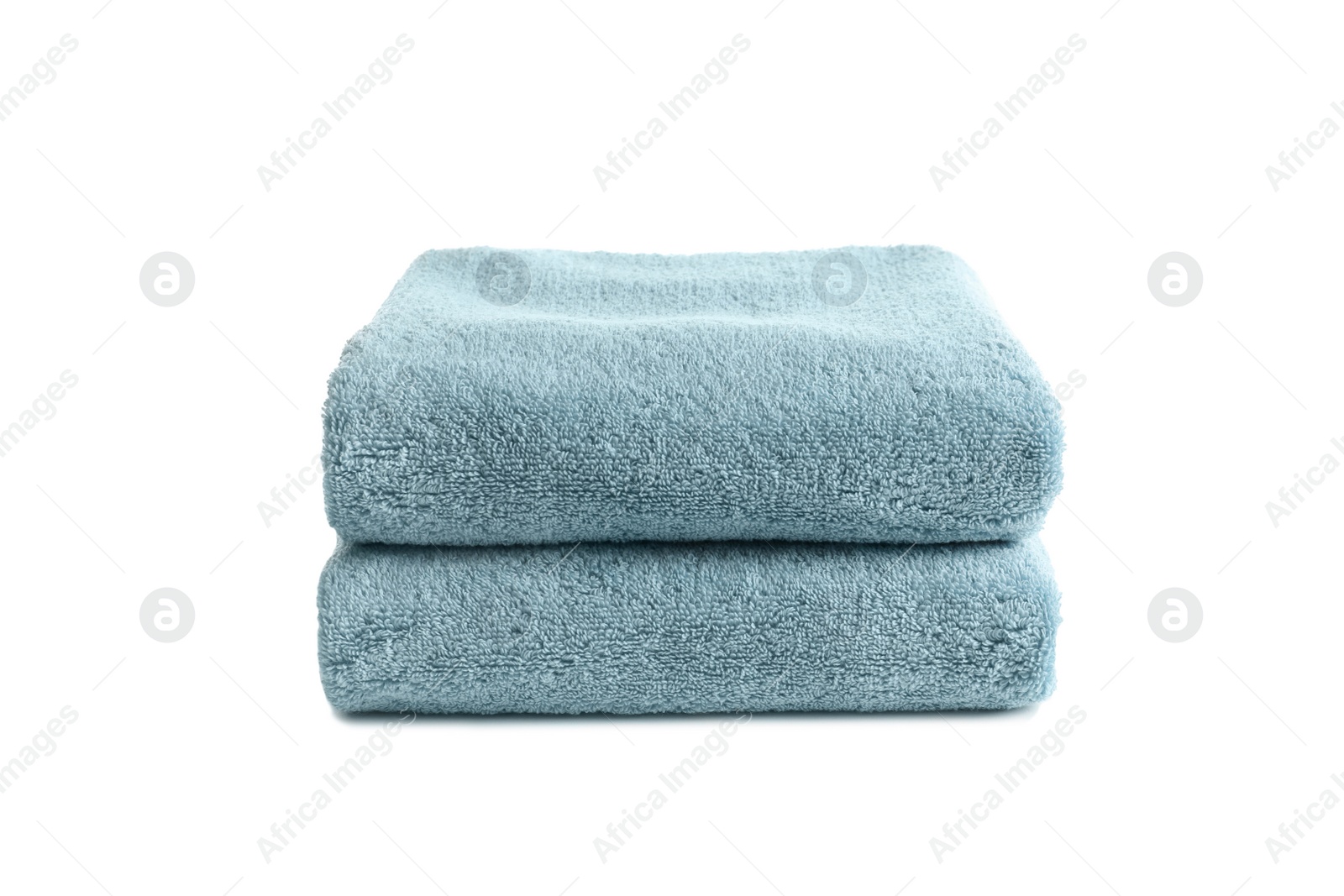 Photo of Folded clean soft towels on white background