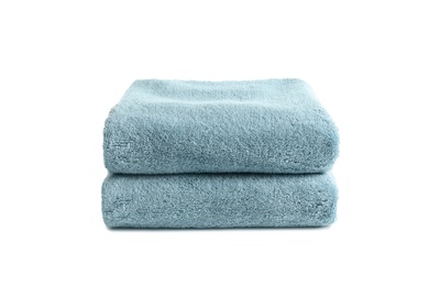 Photo of Folded clean soft towels on white background