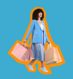 Happy woman with shopping bags on light blue background