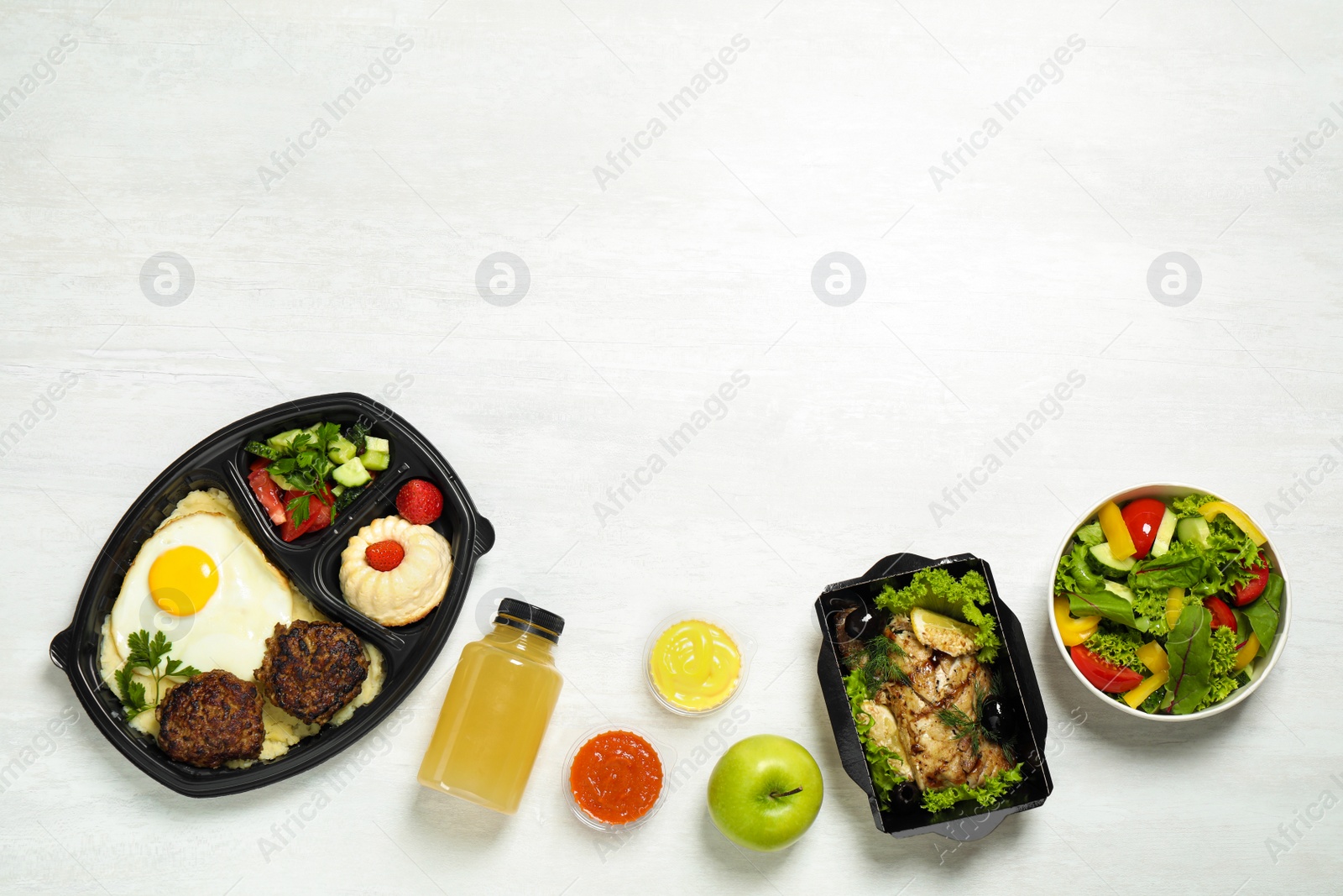 Photo of Flat lay composition with lunchboxes on white table, space for text. Healthy food delivery